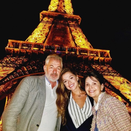 Julia Tsirkin with her father Vladimir Tsirkin and mother Tanyusha Tsirkin in front of Eifel Tower.